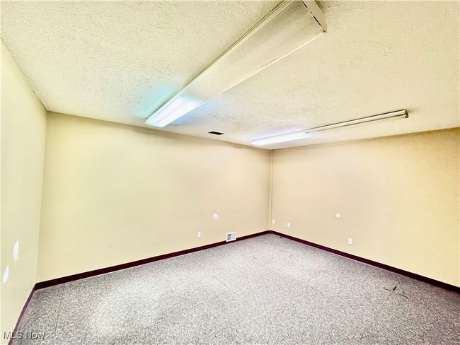 Spare room with carpet and a textured ceiling | Image 10