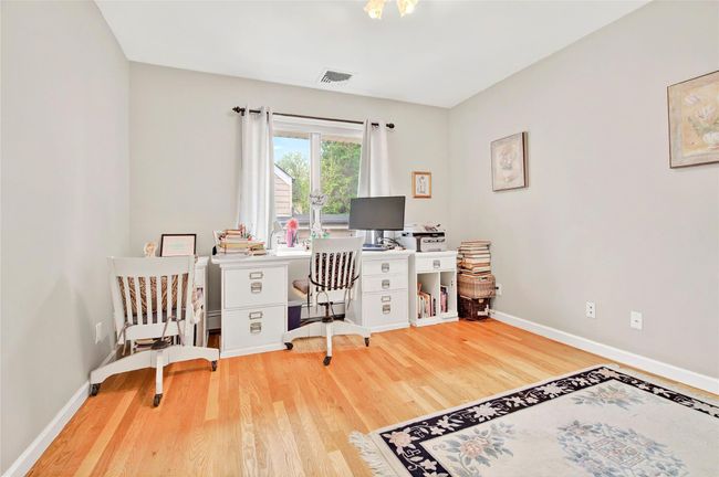 Office space featuring wood finished floors and baseboards | Image 33