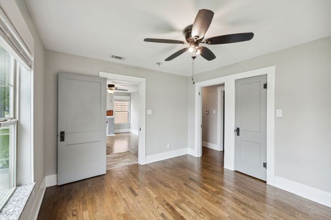 Unfurnished bedroom featuring wood finished floors and a ceiling fan | Image 14