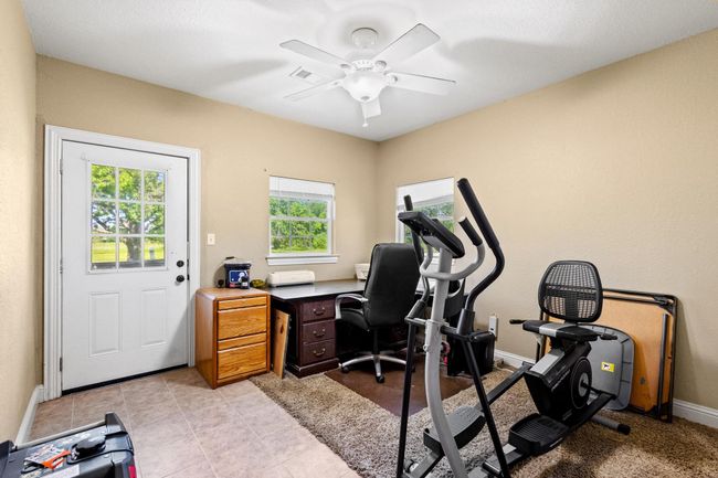 Office space featuring baseboards, ceiling fan, and a healthy amount of sunlight | Image 19