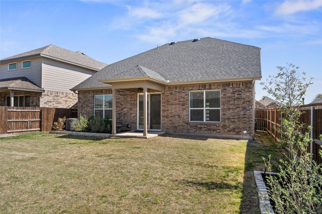 Back of property with a fenced backyard, brick siding, and a yard | Image 35