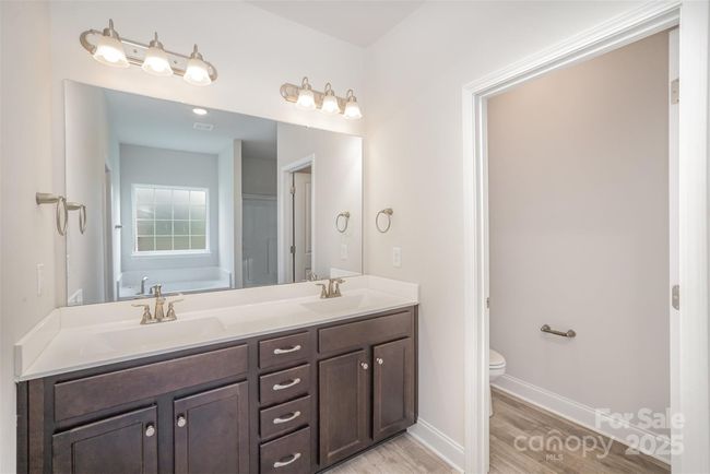 Ensuite Bathroom w/dual sinks and private door to the water closet | Image 16