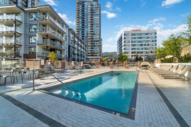 Community pool with fence and a patio area | Image 22