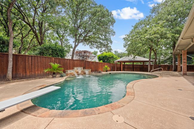 Heated diving pool with waterfall feature | Image 37