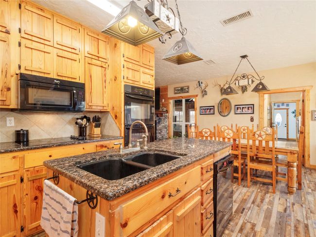 Kitchen offers tall cabinets | Image 10