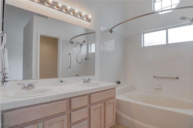 Full bath featuring double vanity, tub / shower combination, and duel sinks | Image 21