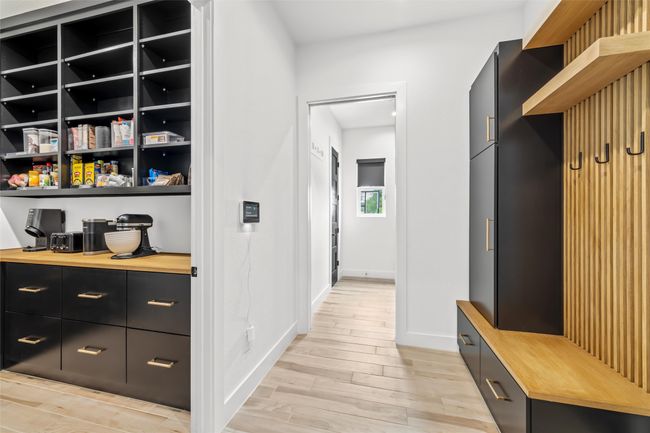 Mudroom with baseboards and light wood-style floors | Image 15