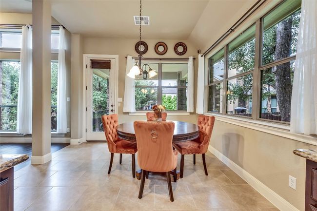 Breakfast space with baseboards and large tile patterned flooring | Image 21