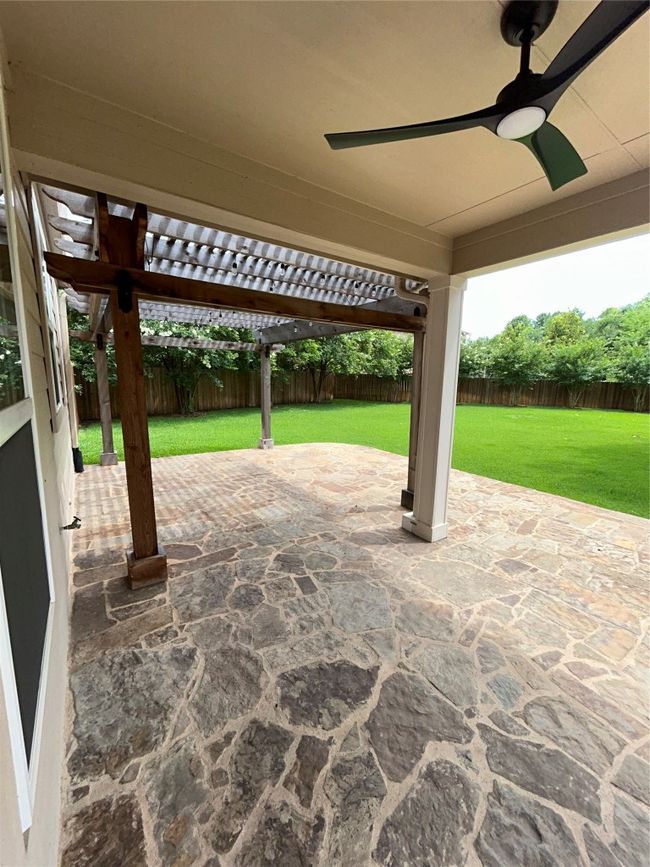 View of patio featuring a ceiling fan and a pergola | Image 22