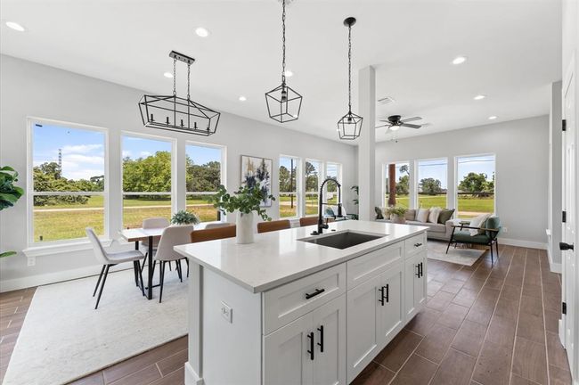 Spacious island that can be used as a breakfast bar. | Image 12