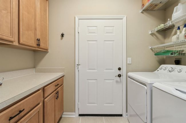 Equipped with washer, dryer, and additional storage. | Image 22