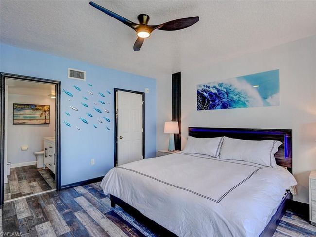 OWNER'S SUITE SHOWING ENTRANCE TO EN-SUITE BATH. CLOSED DOOR LEADS TO WALK-IN CLOSET. | Image 23