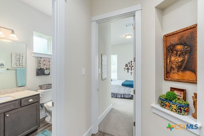 Hallway toward guest bath and front bedroom. | Image 21