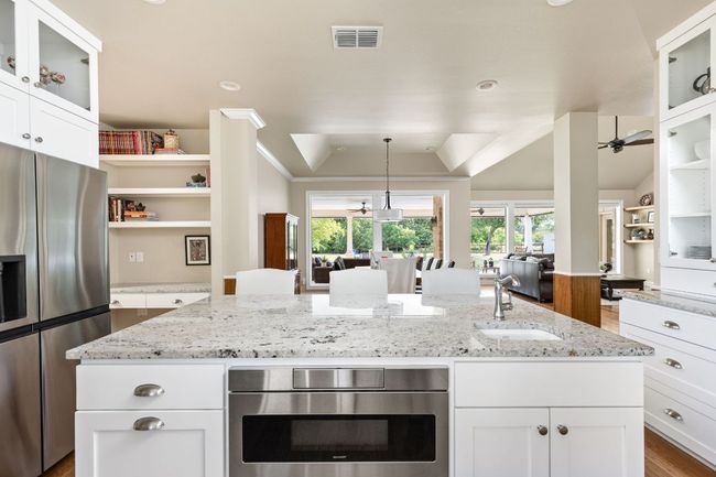 The open design keeps the cook connected to the rest of the home’s living areas. | Image 14