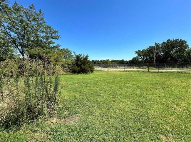 View of yard featuring a rural view and fence | Image 7
