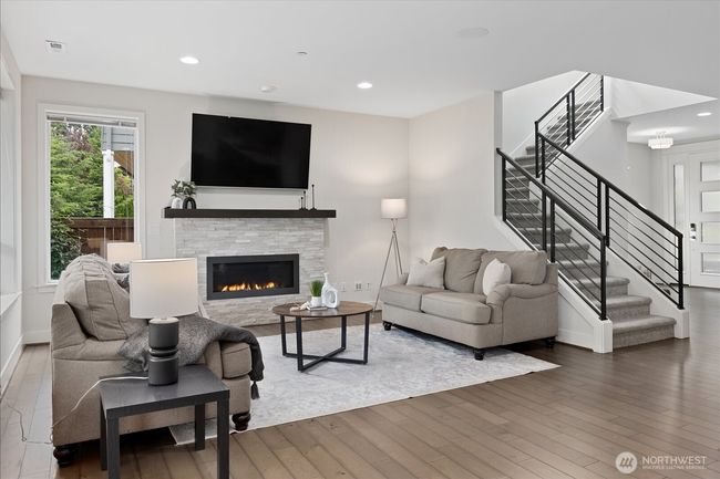 Seamless blend of comfort and style with stone surround fireplace | Image 6