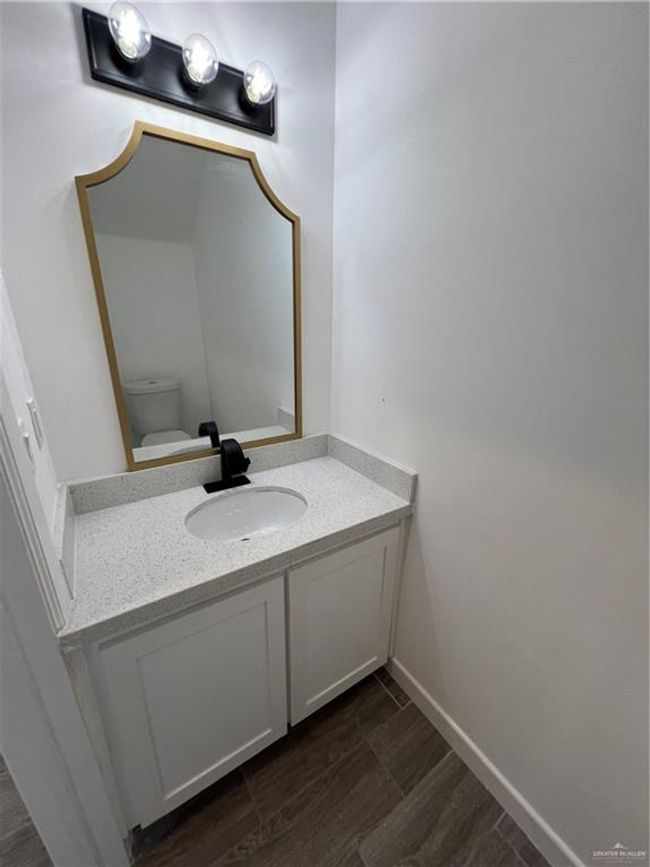 Half bathroom located downstairs | Image 4