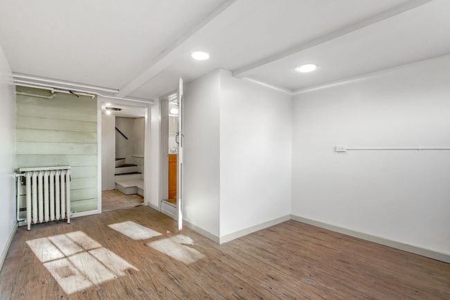 Lower level with access door to bathroom. | Image 20