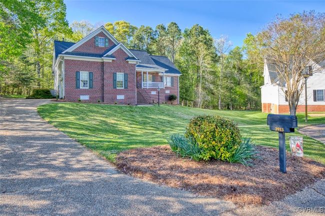 View of front of property with stairway, crawl space, a front lawn, and brick siding | Image 30