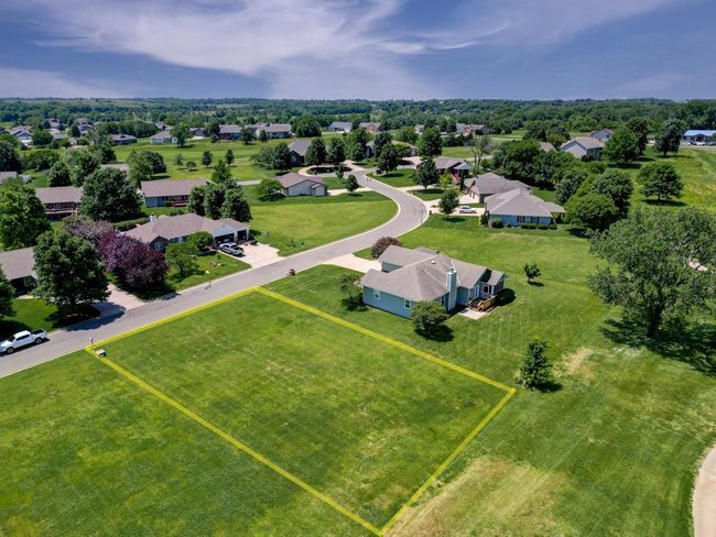 Aerial perspective of suburban area featuring property parcel outlined | Image 4