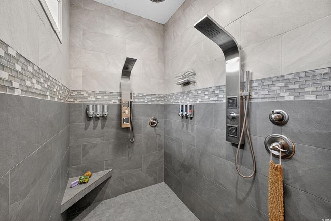 Bathroom featuring tiled shower | Image 23