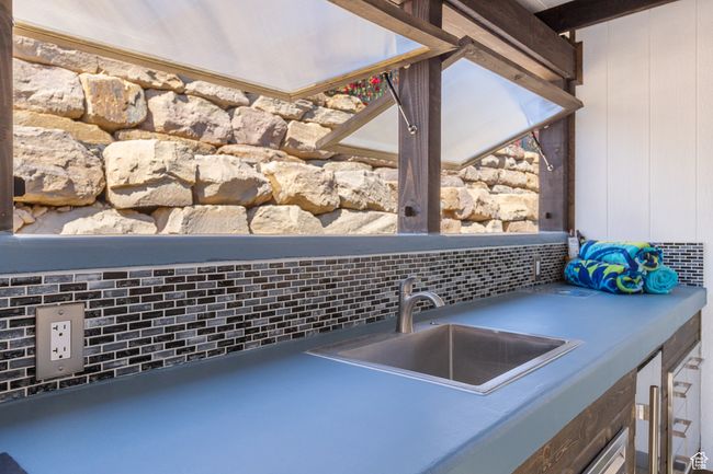 Kitchen view of decorative backsplash and bar with sink | Image 14