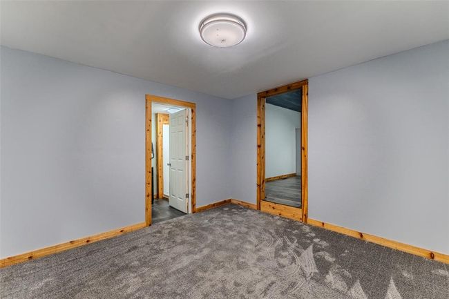 Carpeted spare room featuring baseboards | Image 22