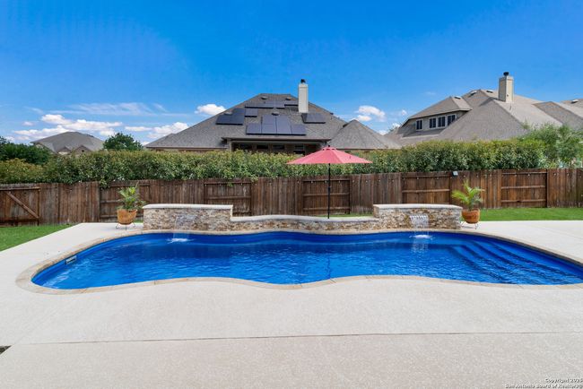 Inviting pool area perfect for relaxation and recr | Image 35