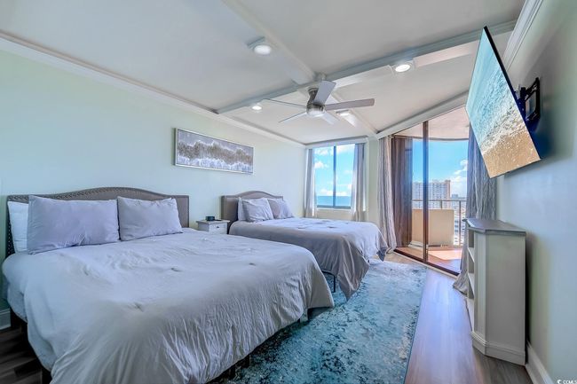 Bedroom featuring ceiling fan, crown molding, and wood-type flooring | Image 22