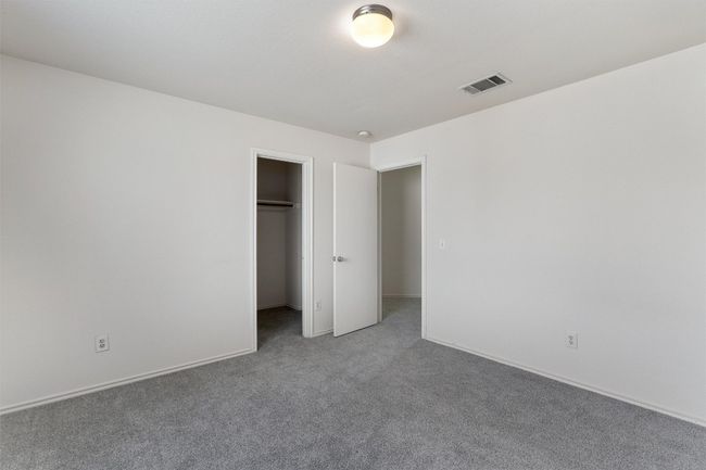 Unfurnished bedroom featuring carpet flooring, a closet, and baseboards | Image 22