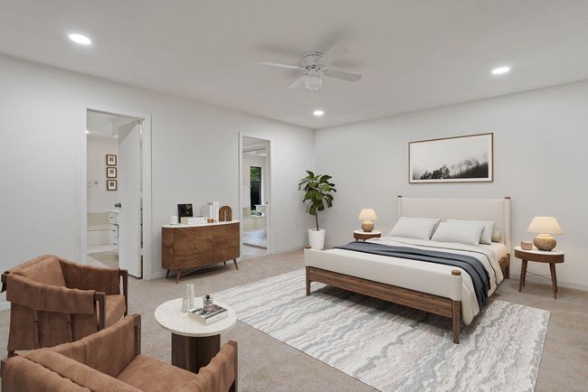 Virtually Staged Primary Bedroom with light colored carpet, recessed lighting, ensuite bathroom, ceiling fan, and baseboards | Image 7