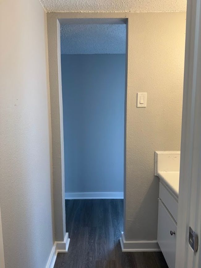 Bathroom with wood finished floors, vanity, and baseboards | Image 13