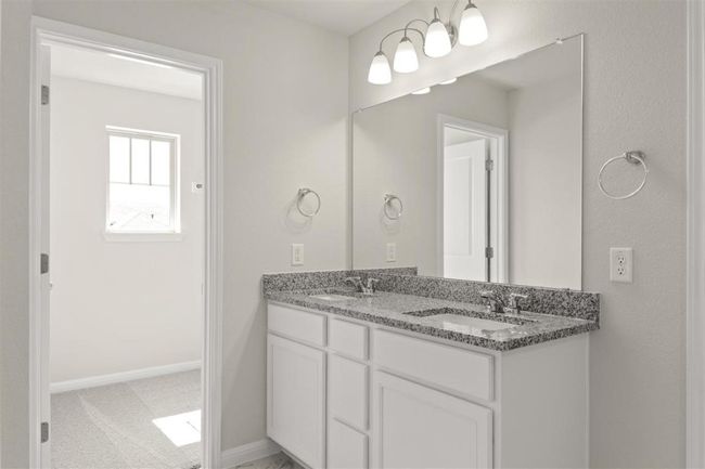 Full bathroom featuring a sink, baseboards, and double vanity | Image 21