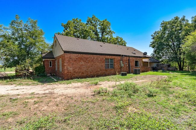 Rear view of property featuring central AC | Image 35