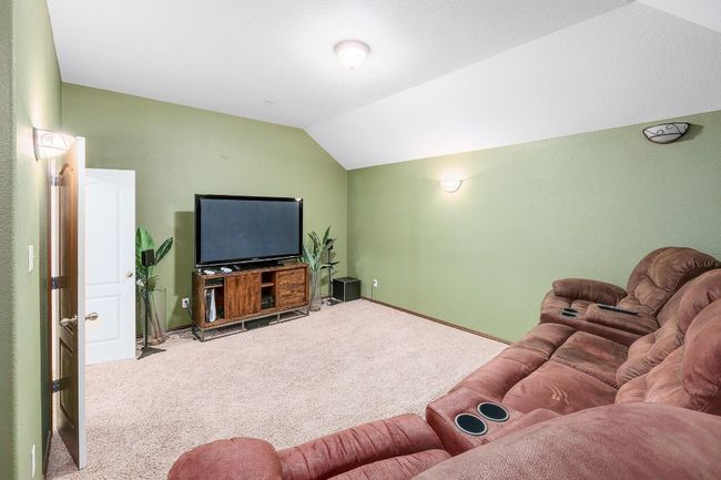 The media room is designed for ultimate entertainment, with ample space for a large screen and seating, creating the perfect spot for movie nights, gaming, or binge-watching your favorite shows in comfort | Image 27
