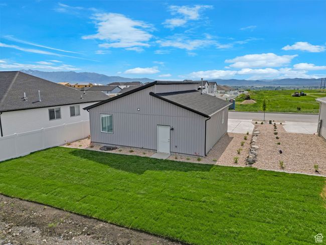 Back of property with a mountain view | Image 20