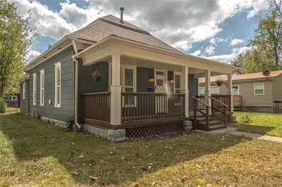 Back of property with a lawn and covered porch | Image 3