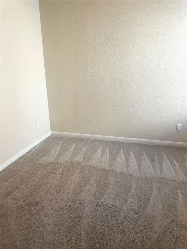 Carpeted spare room featuring baseboards | Image 13