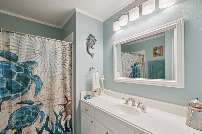 Full bath featuring ornamental molding and vanity | Image 20