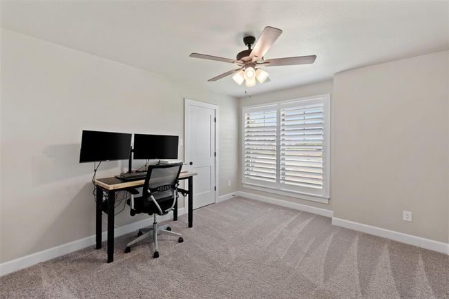 secondary bedroom with large window | Image 20
