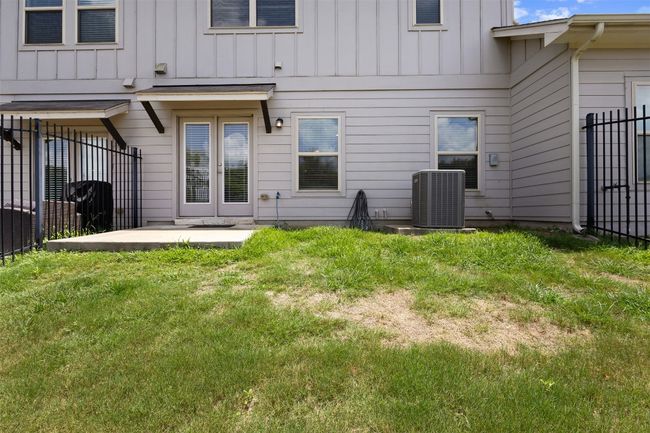 Back of property featuring board and batten siding and a patio area | Image 35
