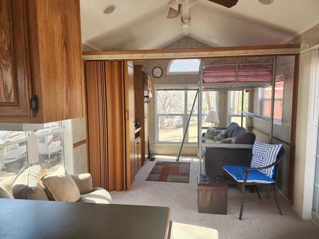 Here's an option with a bunk above the couch - this can stay or be removed. Notice the partition. | Image 18