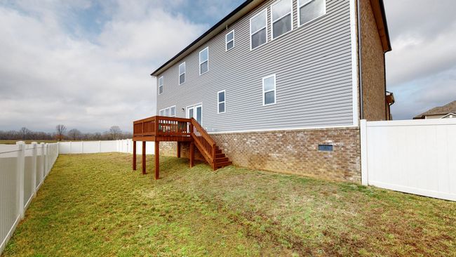 Backyard fenced with long-lasting white vinyl privacy fence | Image 40