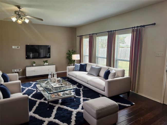 Living room featuring hardwood / wood-style flooring and a ceiling fan | Image 13