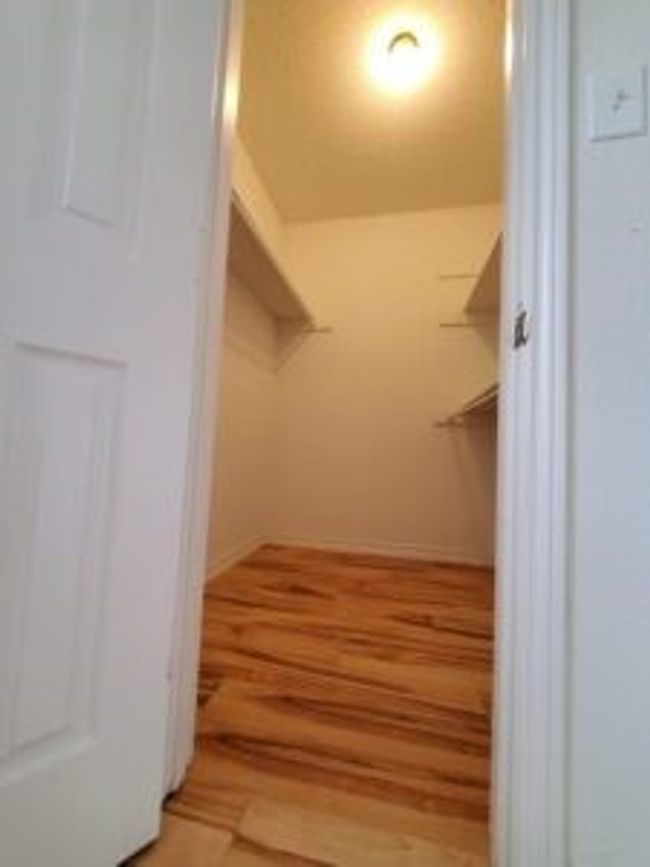 Spacious closet featuring light wood finished floors | Image 35
