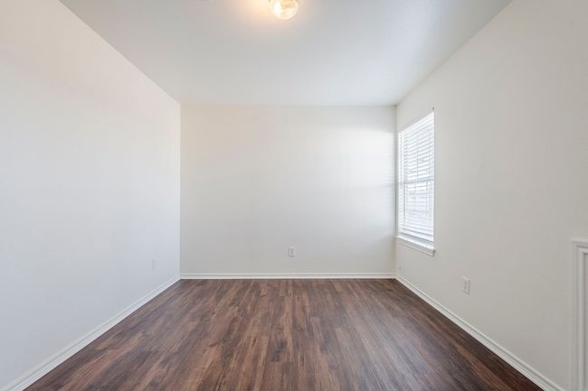 Unfurnished room featuring dark wood finished floors and baseboards | Image 22