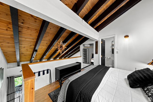 Bedroom featuring wooden ceiling and wood finished floors | Image 14