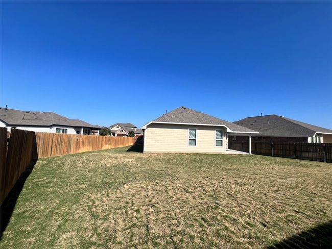 Back of house featuring a patio, a fenced backyard, and roof with shingles | Image 37