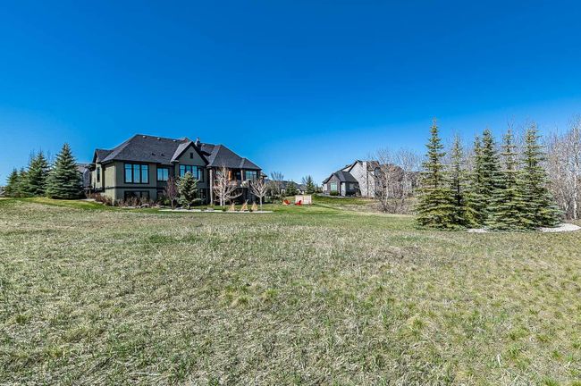 16 Ranche Drive, Home with 4 bedrooms, 3 bathrooms and 6 parking in Heritage Pointe AB | Image 5