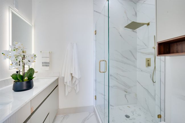 Bathroom featuring vanity and walk in shower | Image 20